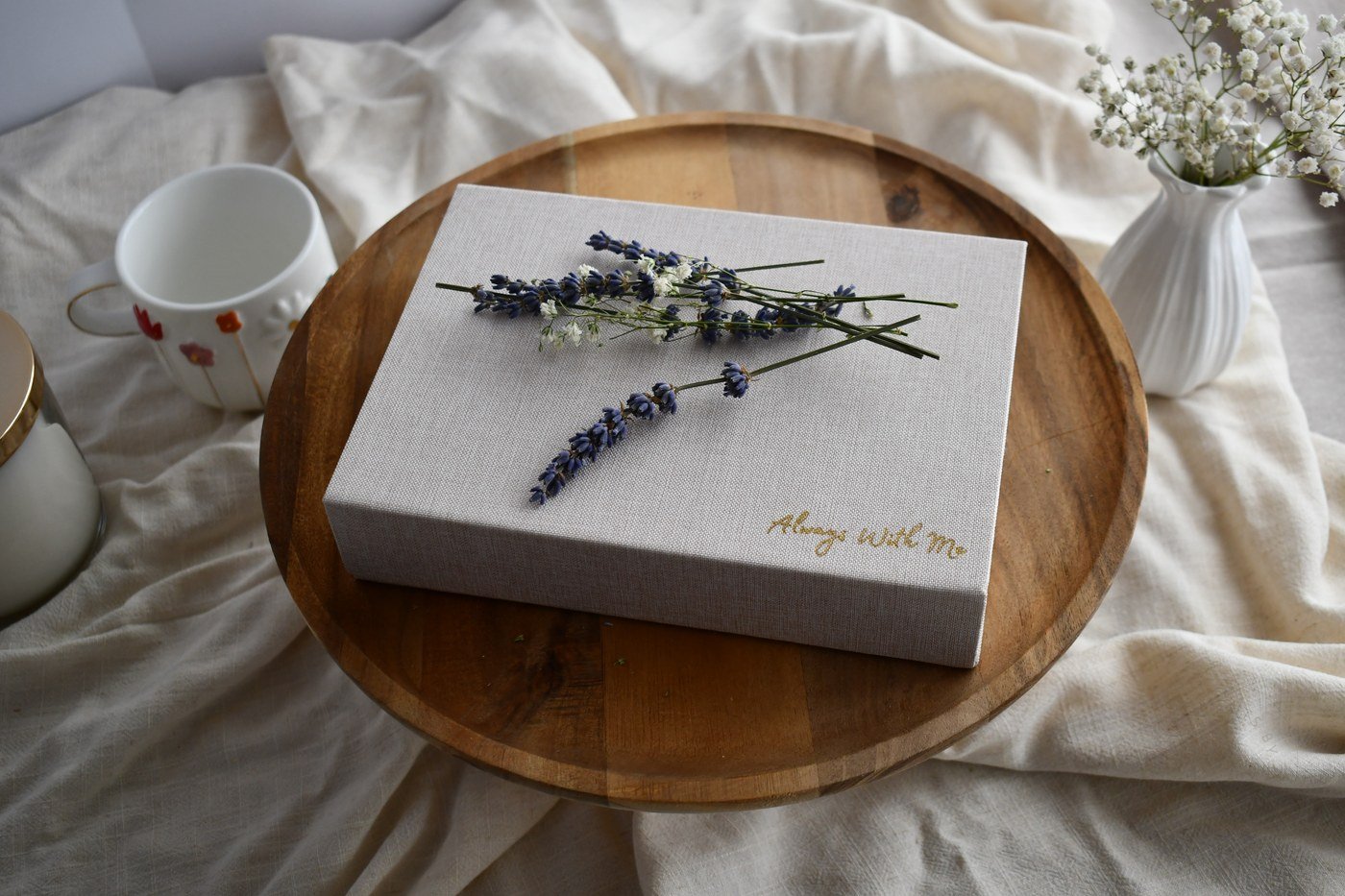 Always With Me keepsake box styled with flowers on a wooden table.