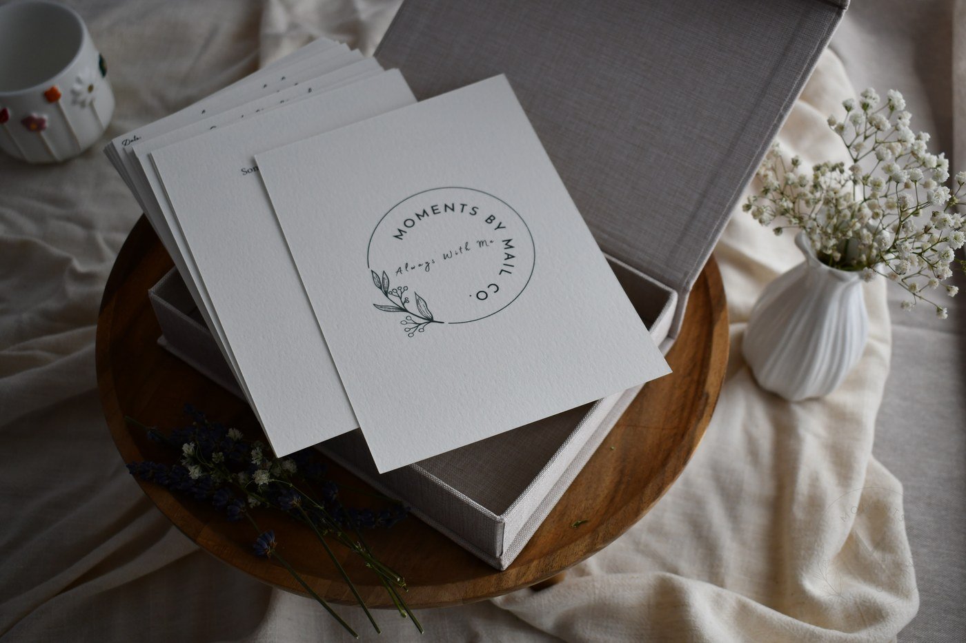 Open Always With Me keepsake box with logo card and flowers.