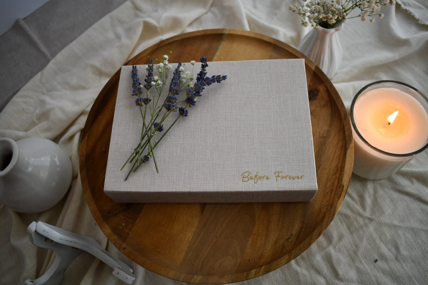 Before Forever keepsake box styled with lavender on a wooden table.